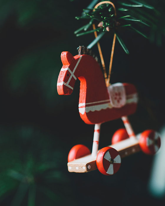 A small red wooden horse