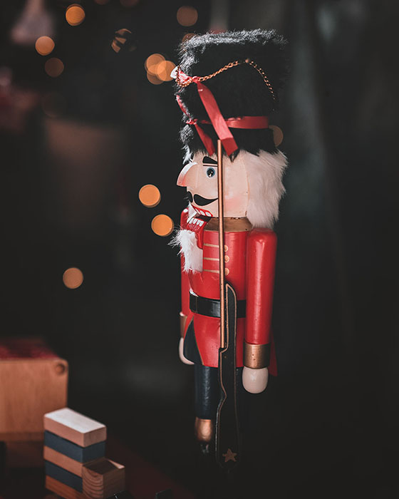 A small red wooden man doll